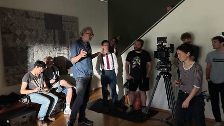 Professor Christian Rein surrounded by the students